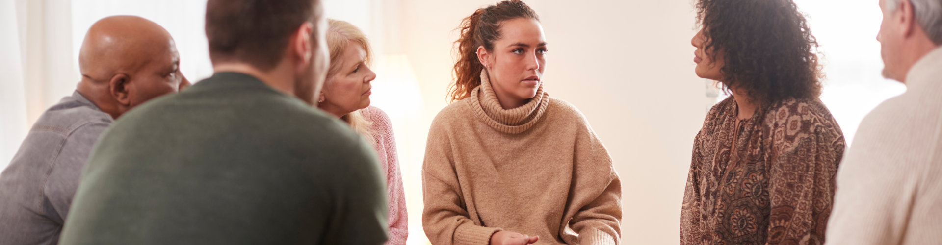 Woman talking to a group of people